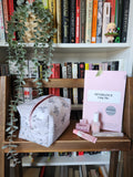 newspaper print makeup bag (pink zipper)