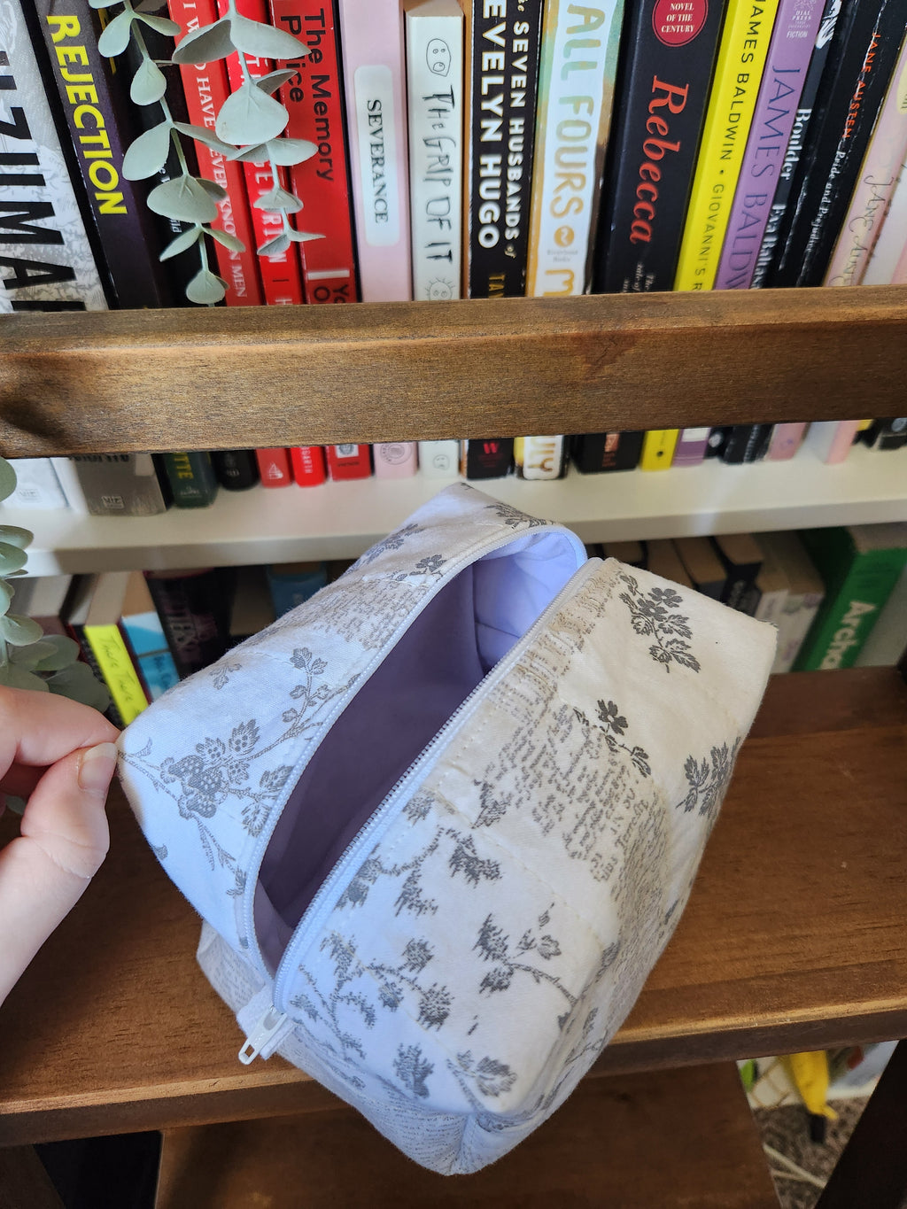 newspaper print makeup bag (white zipper)