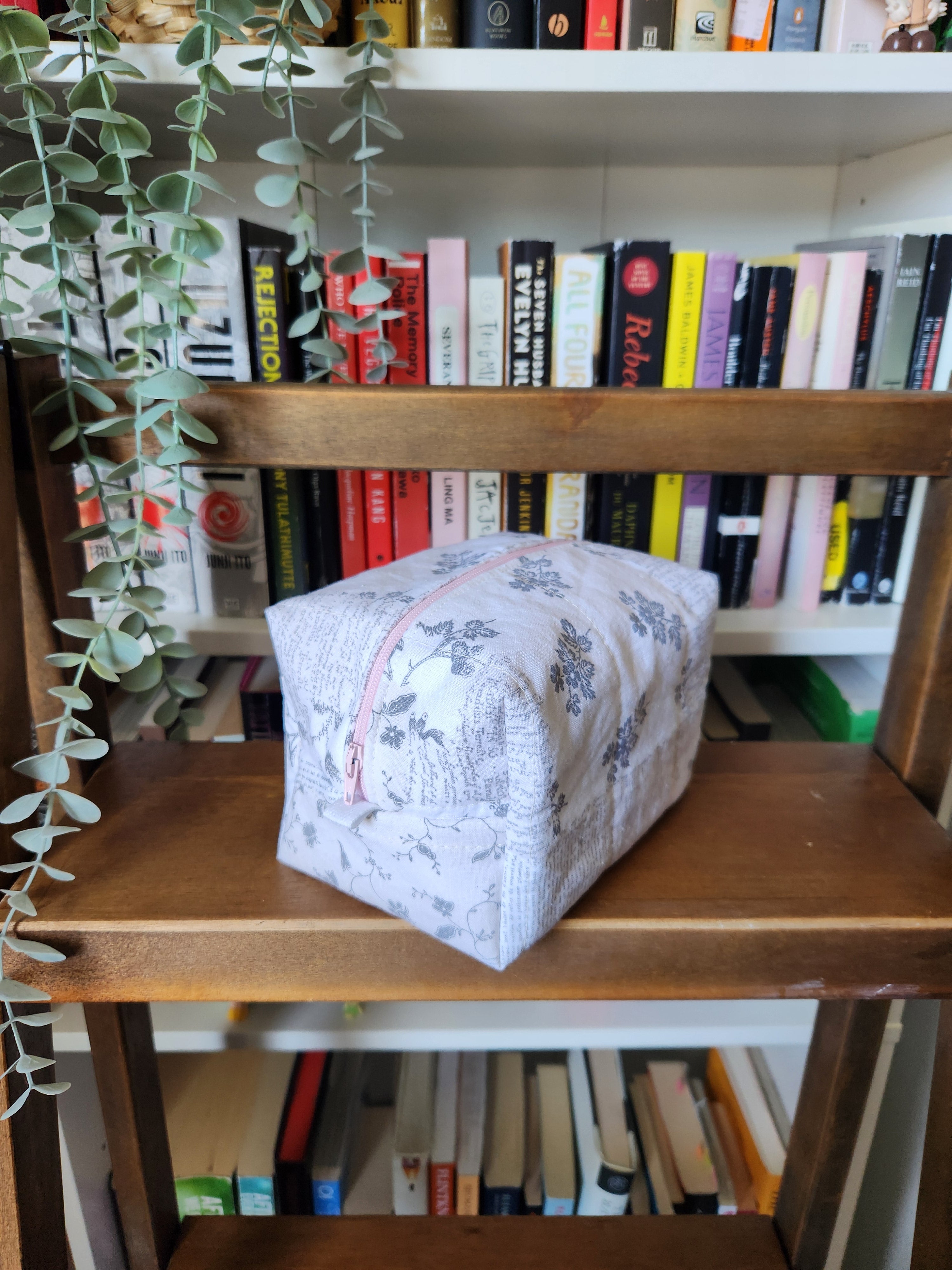 newspaper print makeup bag (pink zipper)