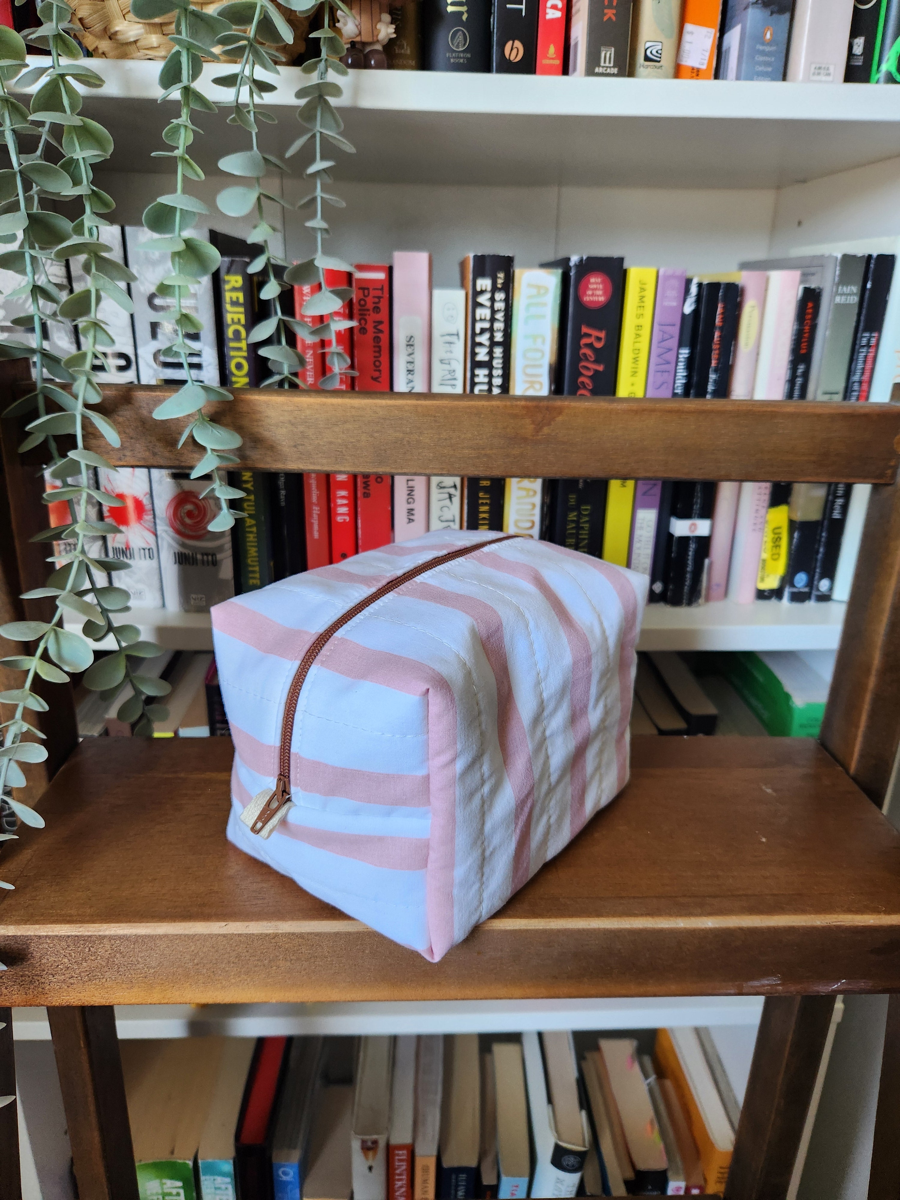 pink and white stripey makeup bag (brown zipper)